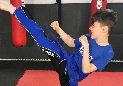 Child Martial Artist Smiling in Taekwondo in Swindon